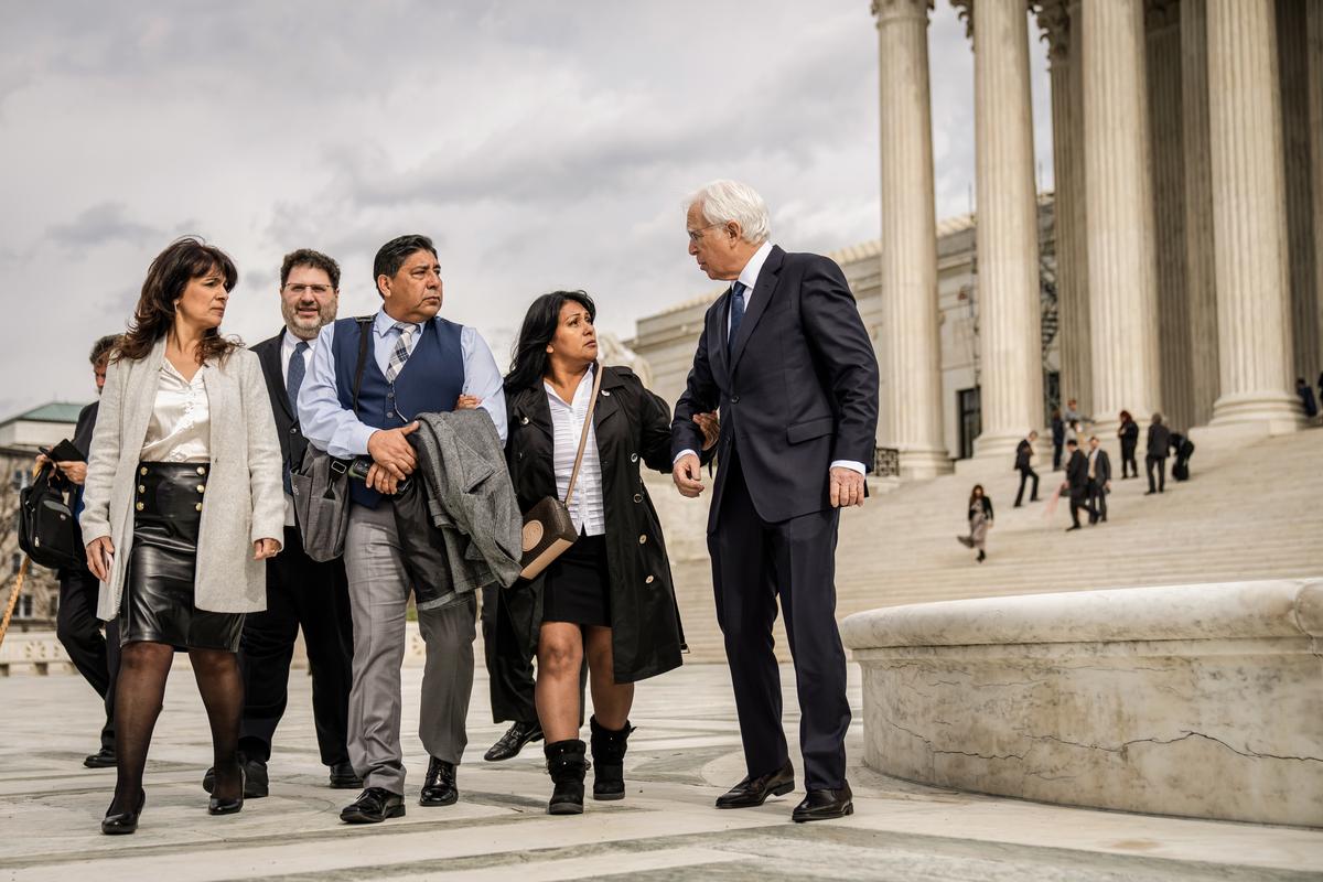 Jose Hernandez (3rd L) and Beatriz Gonzalez (2nd R), stepfather and mother of Nohemi Gonzalez, who died in a terrorist attack in Paris in 2015, walk with their attorney Eric Schnapper (R) outside of the U.S. Supreme Court in Washington on Feb. 21, 2023. (Drew Angerer/Getty Images)