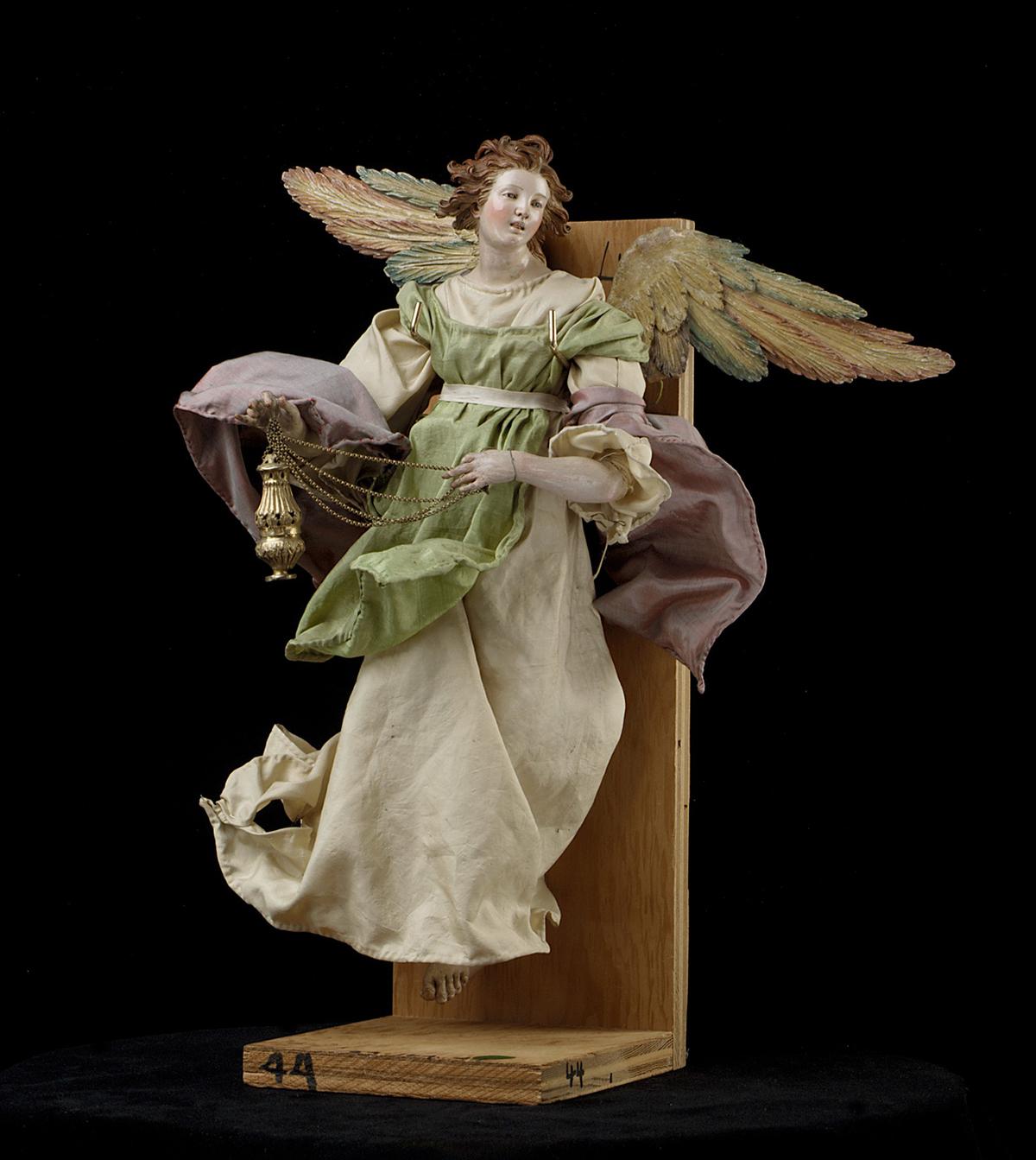 Angel, 18th century, attributed to Giuseppe Sanmartino. Polychromed terracotta head; wooden limbs and wings; body of wire wrapped in tow; various fabrics. Gift of Loretta Hines Howard, The Metropolitan Museum of Art, New York City. (Public Domain)