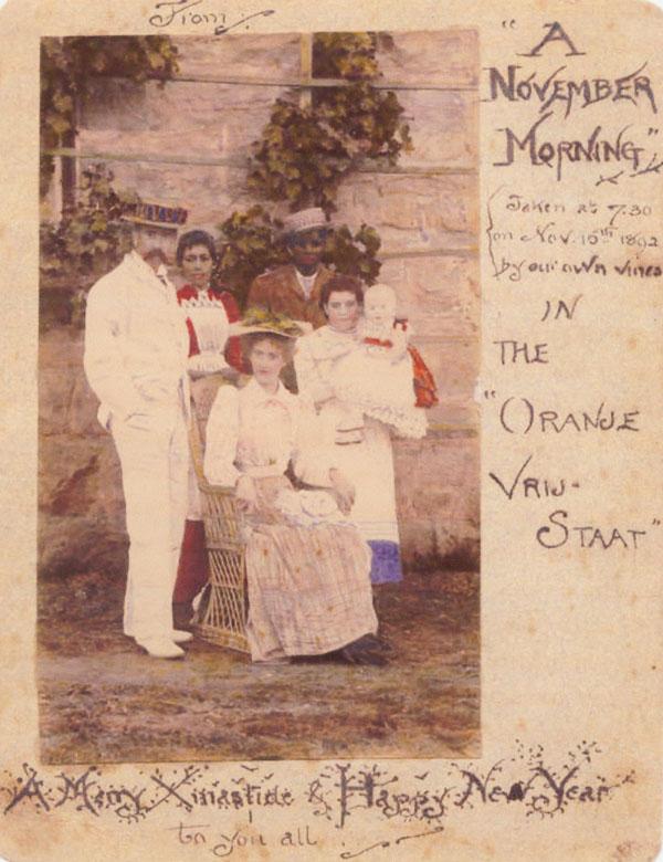 A 1892 Christmas card with a colored photo of the Tolkien family in Bloemfontein, South Africa, sent to relatives in Birmingham, England. (Public Domain)