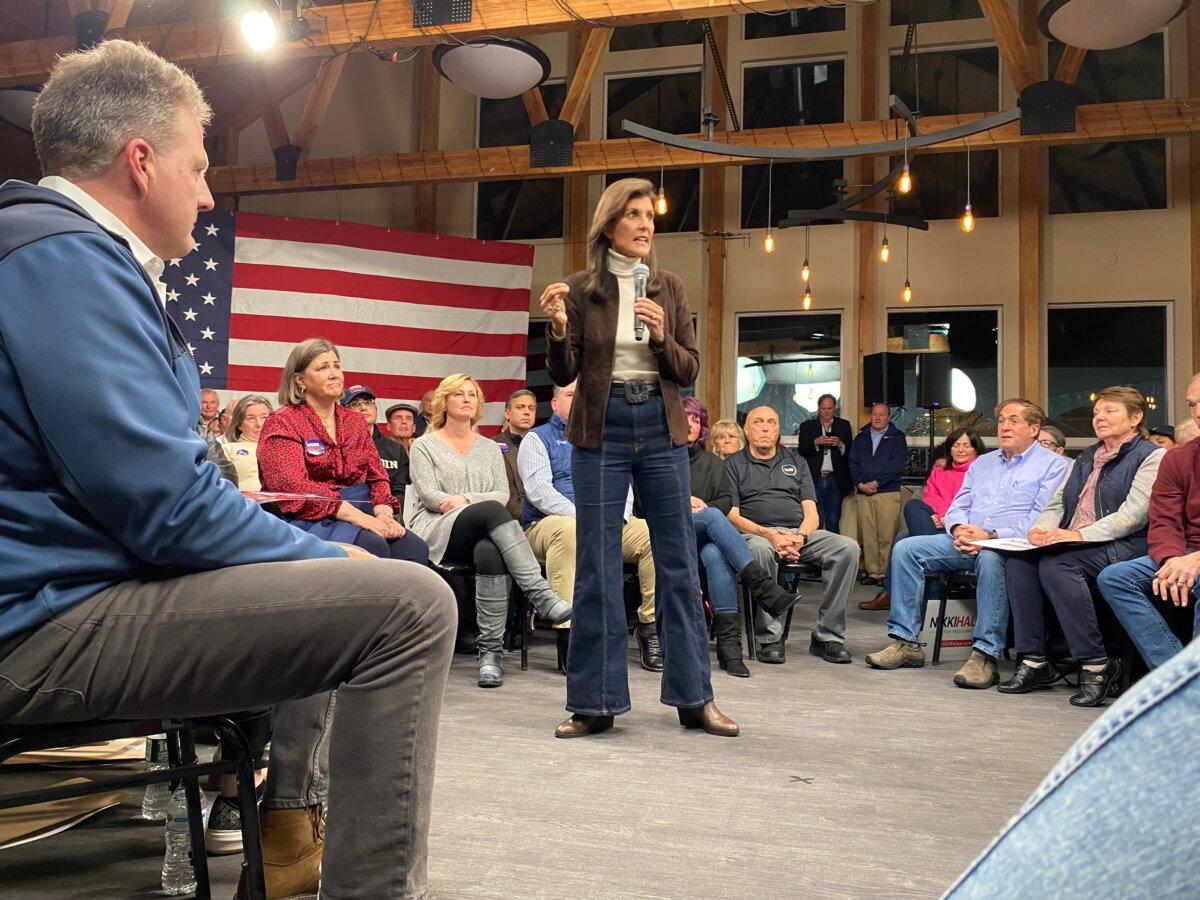 Presidential candidate Nikki Haley spoke to a crowd of supporters at the McIntyre Ski Resort in Manchester, N.H. after winning the endorsement of New Hampshire Gov. Chris Sununu, seen seated in the front. (Alice Giordano)