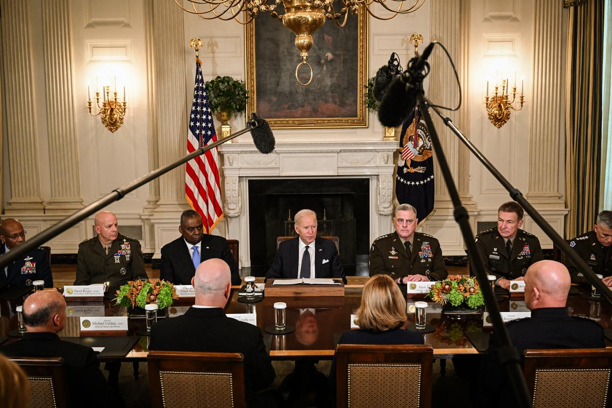  President Joe Biden (C) flanked by Defense Secretary Lloyd Austin and Chairman of the Joint Chiefs of Staff General Mark Milley, meets with defense leaders to discuss national security priorities, in the White House in Washington on Oct. 26, 2022. (Saul Loeb/AFP via Getty Images)