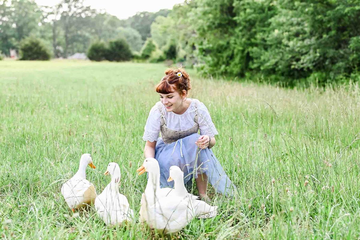 Mrs. Lewis delights in the company of a group of ducks. (Courtesy of <a href="https://www.instagram.com/mrsarialewis">Aria Lewis</a>)
