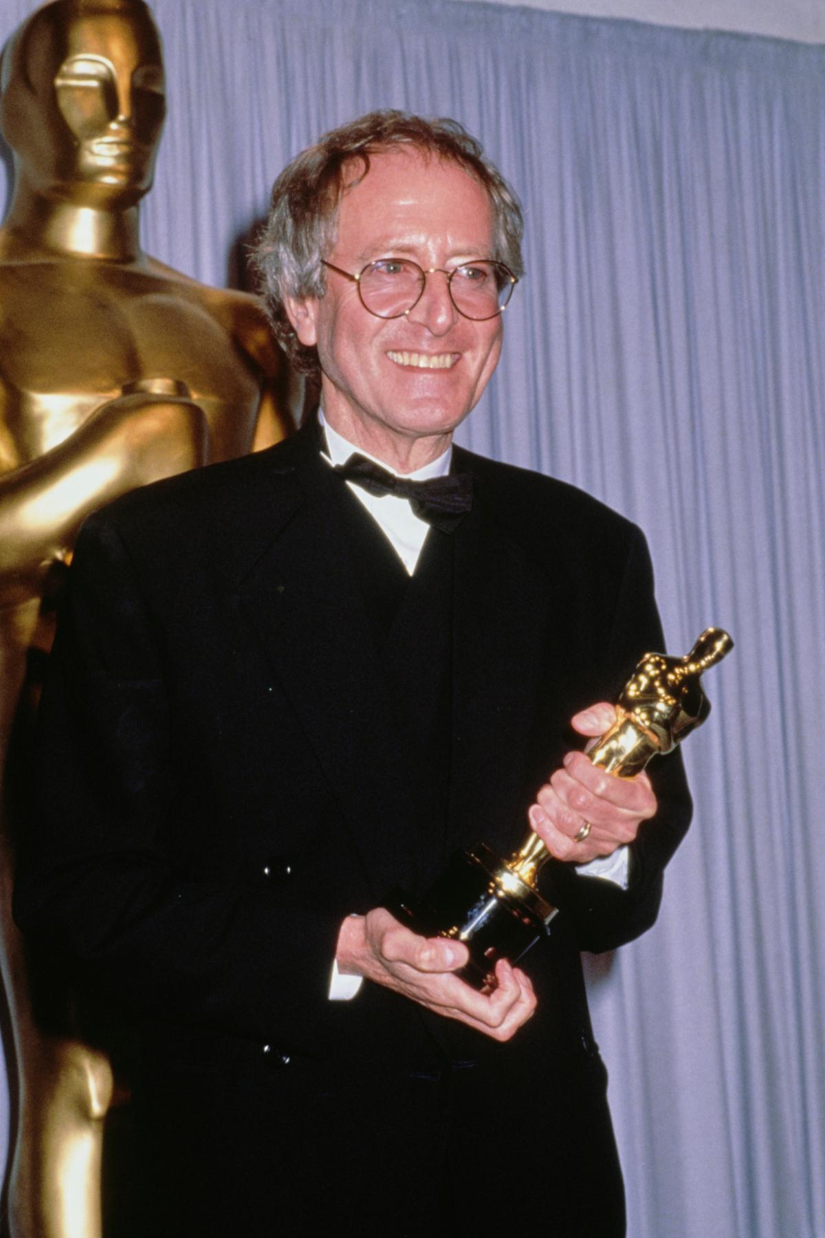 Composer John Barry holding his Best Original Score award for "Dances with Wolves," at the 63rd Annual Academy Awards in 1991. (Vinnie Zuffante/Getty Images)