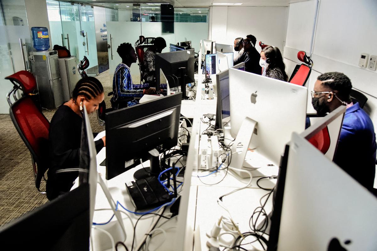 Reporters work in an office at their station in Lagos on June 10, 2021. (Pius Utomi Ekpei/AFP via Getty Images)