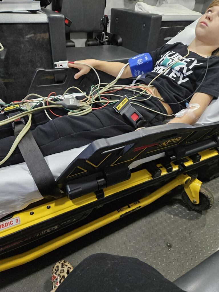 Hayden Wright, 10, lies on a stretcher after eating gummy bears tainted by fentanyl in Amherst, Va. on Dec. 12, 2023. (Courtesy of Kristina Wright)