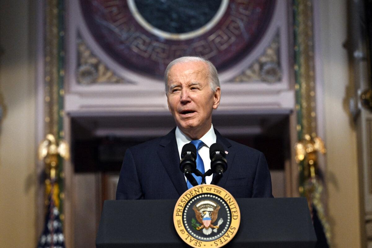 President Joe Biden speaks at a meeting of the National Infrastructure Advisory Council, in the Indian Treaty Room of the White House in Washington. on Dec. 13, 2023. (Jim WATSON/AFP)
