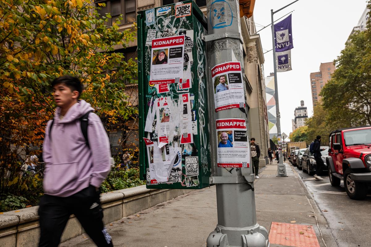 Posters showing some of those kidnapped by Hamas in Israeli are displayed on a pole outside of New York University as tensions between supporters of Palestine and supporters of Israel increase on college campuses across the nation, in New York City on Oct. 30, 2023. (Spencer Platt/Getty Images)
