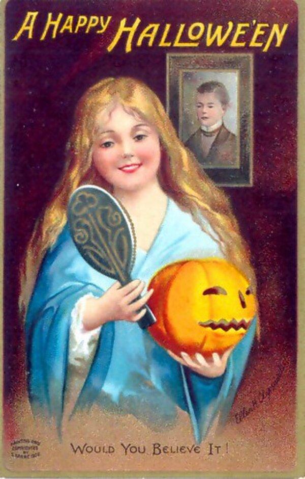 Folklore says that a girl can see her future husband in a mirror on Halloween. Ellen Clapsaddle's Halloween 1904 postcard. (Public Domain)