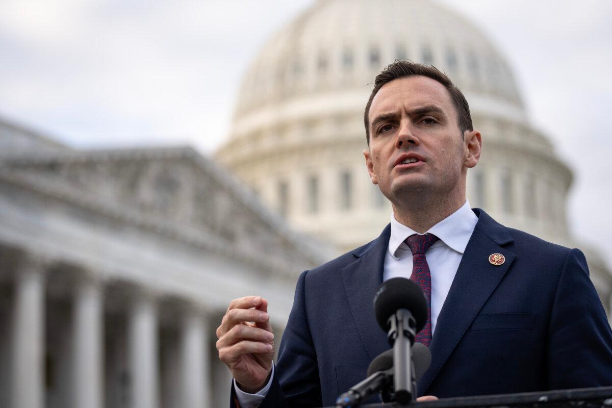 Chairman of the House Select Committee on China Rep. Mike Gallagher (R-Wis.) delivers remarks to commemorate the one-year anniversary of the White Paper movement in China alongside a group of students and Chinese pro-democracy activists outside the U.S. Capitol in Washington on Nov. 29, 2023. (Drew Angerer/Getty Images)