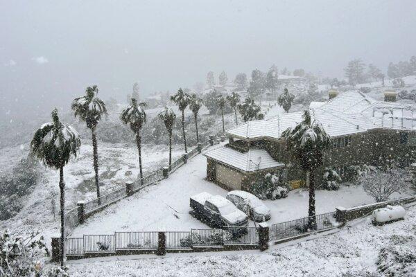 Snow blankets a home in Rancho Cucamonga, Calif., on Feb. 25, 2023. (Josh Edelson/AFP via Getty Images)