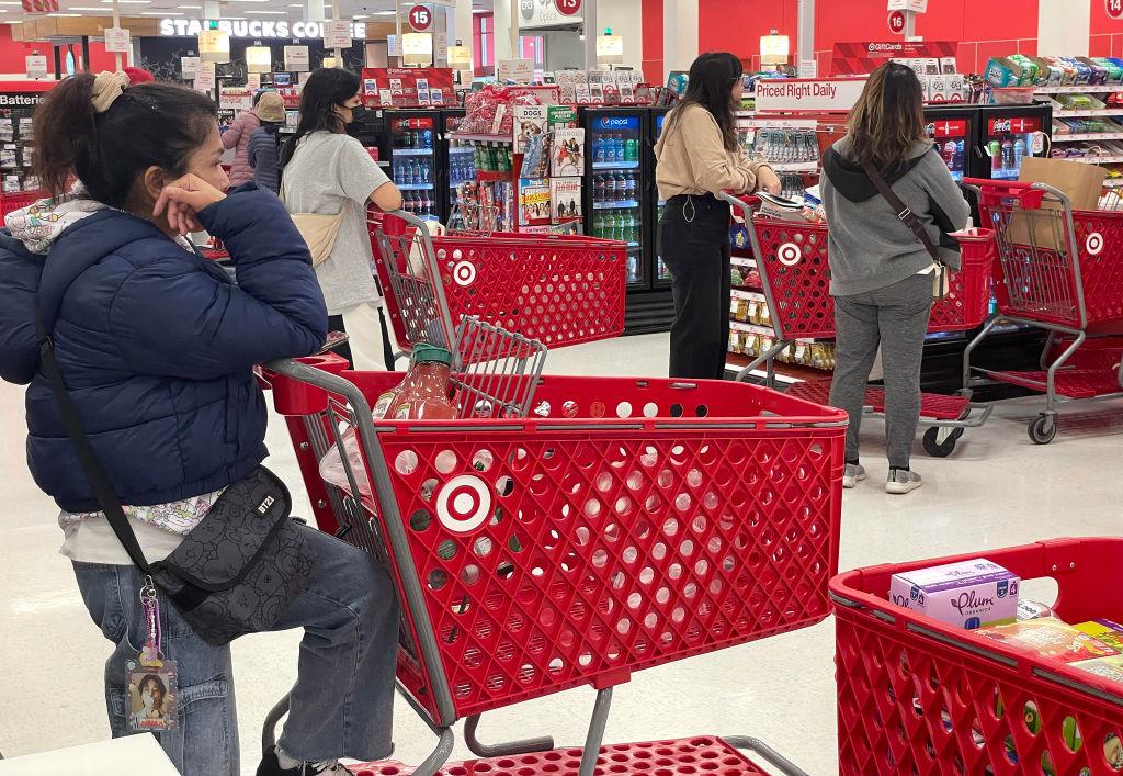 Customers wait in line to make purchases at a Target store in Daly City, Calif., on Dec. 14, 2023. (Justin Sullivan/Getty Images)