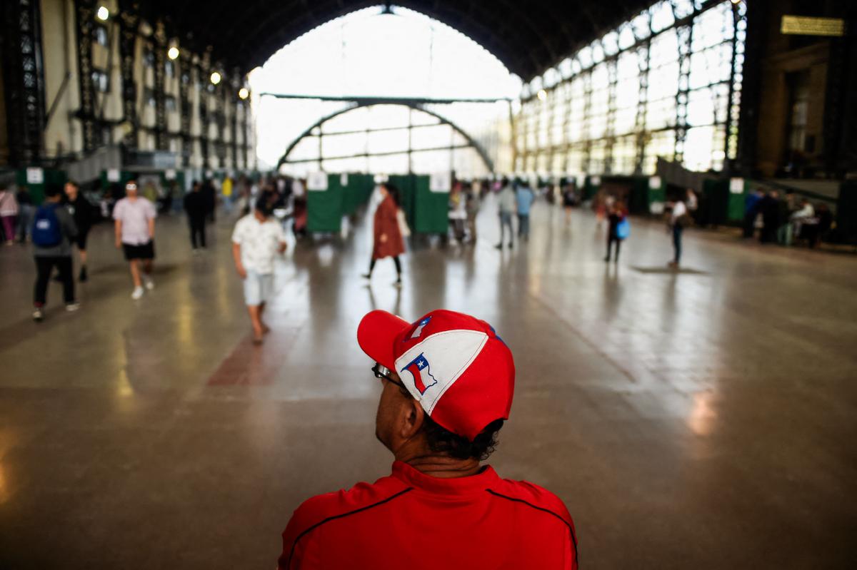 A man wearing a Chilean flag cap stands inside a polling station during the referendum for Chile's new constitution proposal, in Santiago, Chile, on Dec. 17, 2023. (Pablo Vera/AFP via Getty Images)