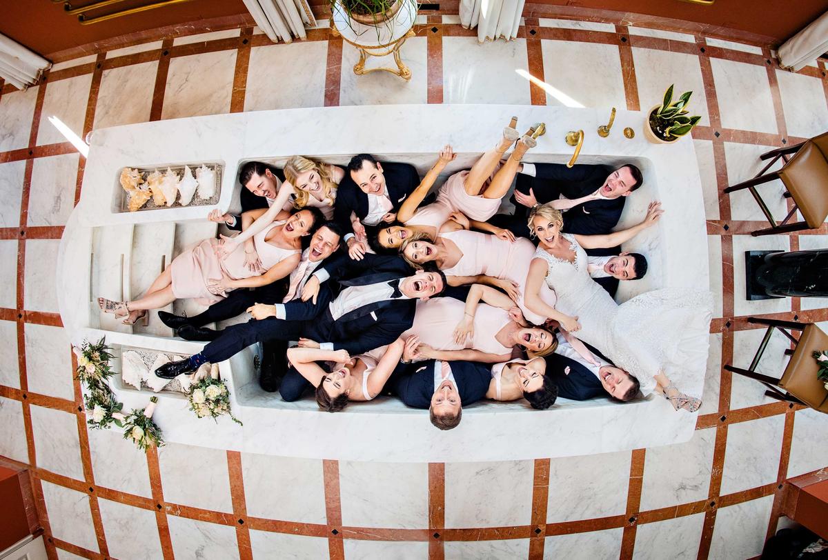 The Bridal Party Attendees To Wedding Couple On Wedding Day by Jeff Tisman for the category, "The 'I-do' crew / group shot." (Courtesy of Jeff Tisman via <a href="https://iwpoty.com/">International Wedding Photographer of the Year 2023</a>)