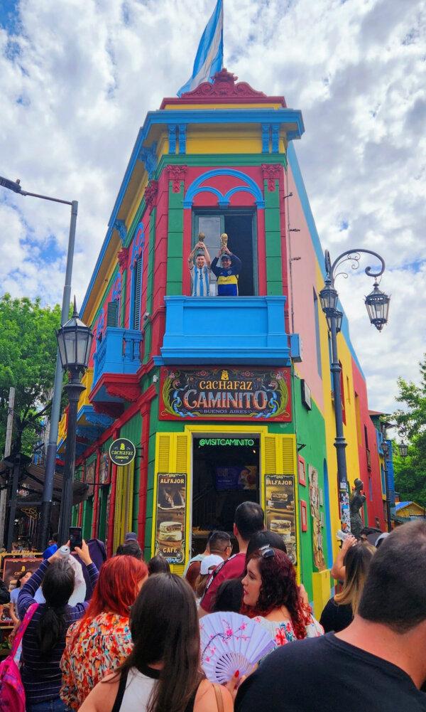 A tourist posed for a photo with a lifelike figure of Argentine soccer champion Lionel Messi at the Caminito in Buenos Aires. (Simon Peter Groebner/Minneapolis Star Tribune/TNS)