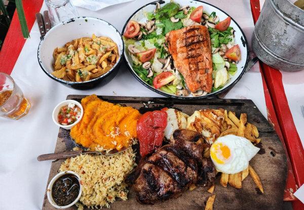 A gran bife spread at Las Cabras parilla (steakhouse) in Buenos Aires, with a salmon platter and beer and wine, cost the traveler U.S. $38. (Simon Peter Groebner/Minneapolis Star Tribune/TNS)