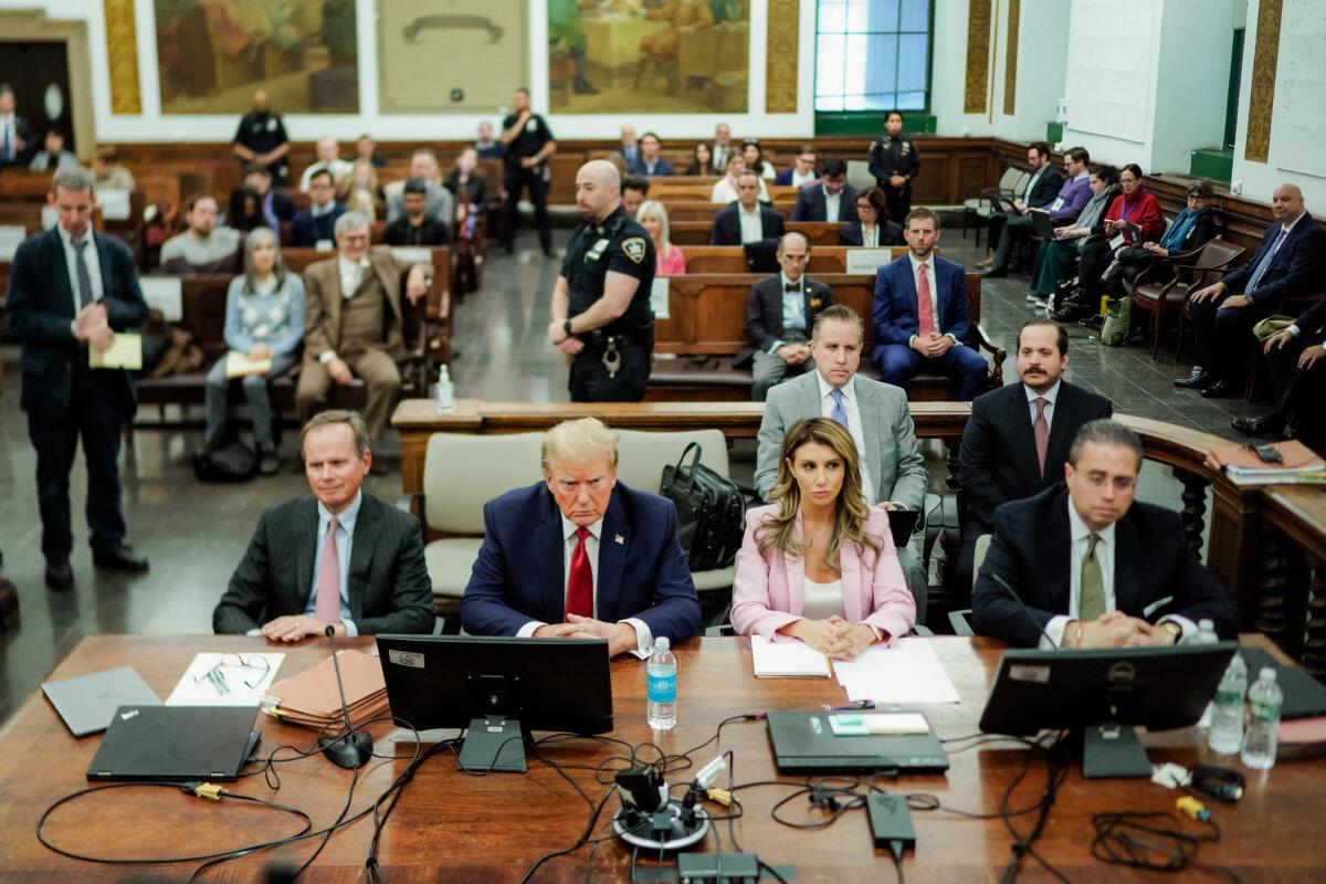 Former President Donald Trump sits at the defense table with his attorneys Christopher Kise (L) and Alina Habba (2nd R) in the New York State Supreme Court in New York City on Dec. 7, 2023. (Eduardo Munoz Alvarez-Pool/Getty Images)