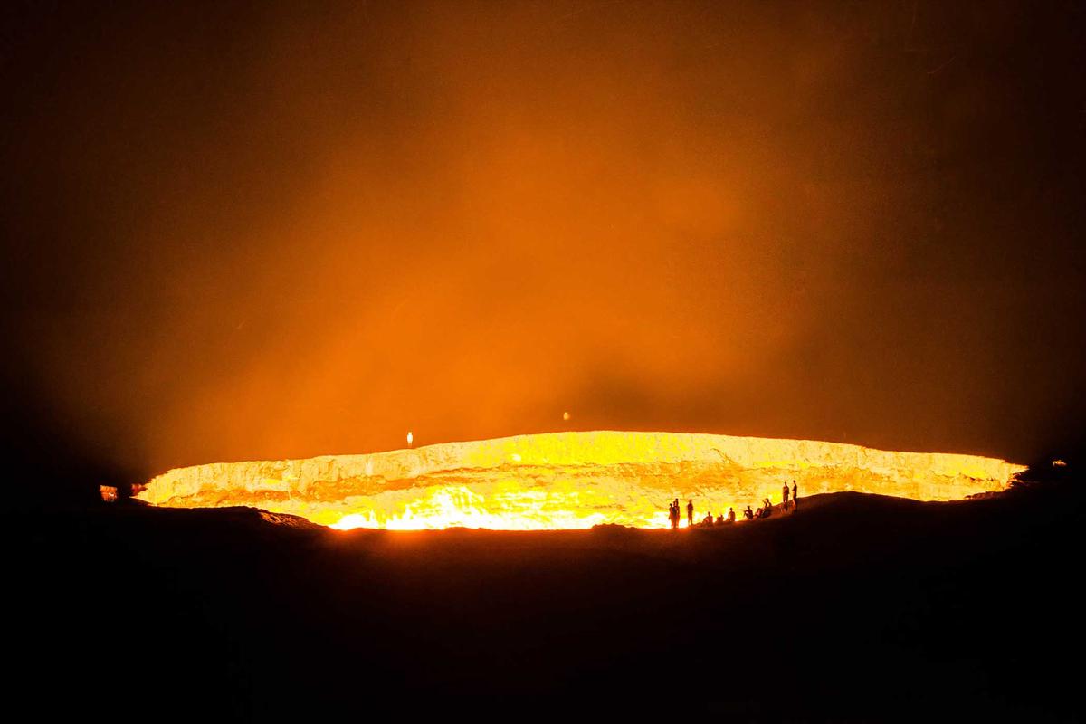 Several people appear like tiny ants next to the enormous inferno. (Antonin Vinter/Shutterstock)