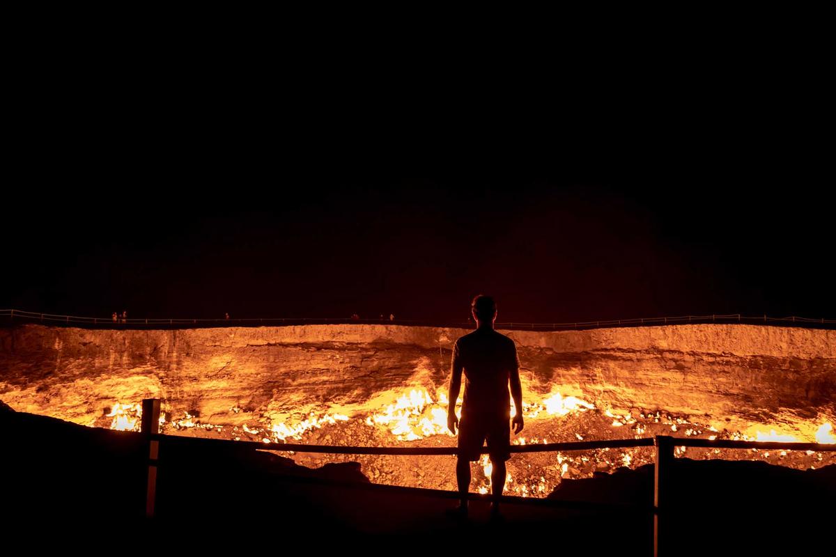 A man looks on into the fiery depths of the Gates of Hell. (LMspencer/Shutterstock)