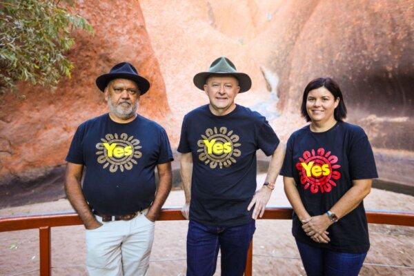 Australian Prime Minister Anthony Albanese (C) stands with Indigenous rights activist Noel Pearson (R) and now-former Northern Territory Chief Minister Natasha Fyles at the base of Uluru, also known as Ayers Rock, in the Uluru Kata Tjuta National Park in central Australia on October 11, 2023. (Stringer/AFP via Getty Images)