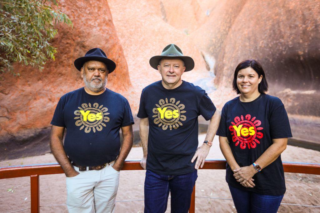 Australian Prime Minister Anthony Albanese (C) stands with Indigenous rights activist Noel Pearson (R) and Northern Territory Chief Minister Natasha Fyles at the base of Uluru. MP John Ruddick thinks the closure of Mt Warning needs to be rescinded to avoid the same issues experienced from the public closure of Uluru. (STRINGER/AFP via Getty Images)