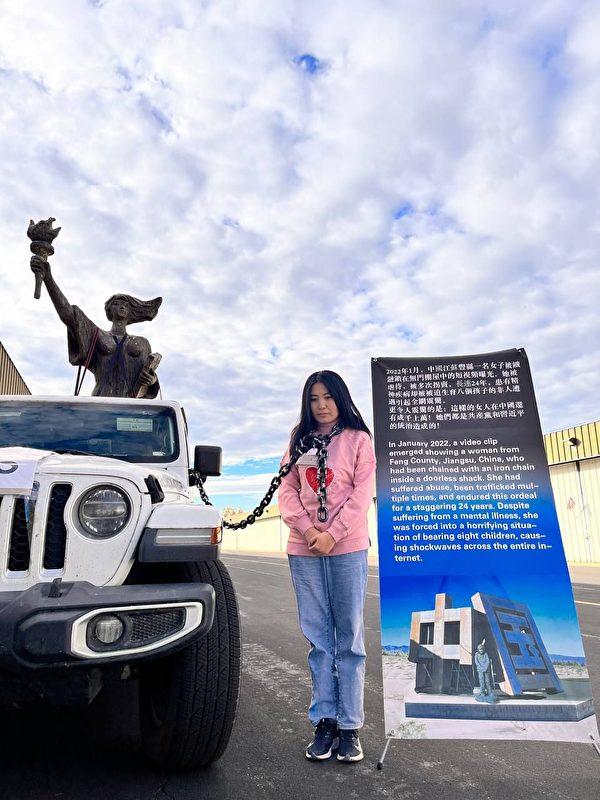 A reenactment by Zheng Min of the Chained Woman at the unveiling ceremony of the chained woman’s sculpture at the Liberty Sculpture Park in Yermo, Calif., on June 4, 2023. (Courtesy of Zheng Min)