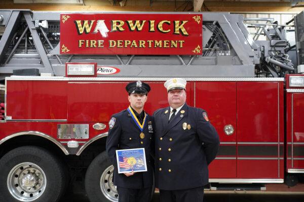 Volunteer firefighter Kevin Colomba and Warwick Fire Chief Michael Contaxis at the Warwick Fire Department in Warwick, N.Y., on Dec. 19, 2023. (Cara Ding/The Epoch Times)