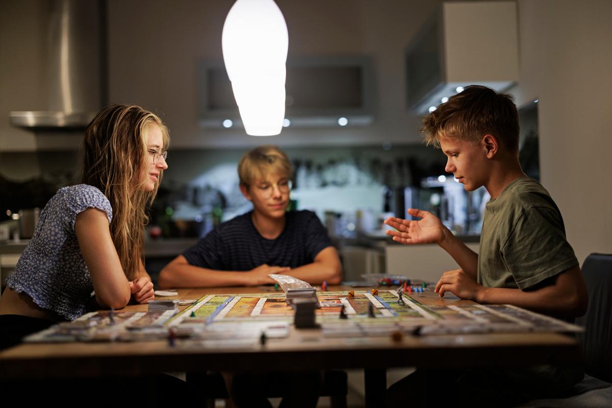 Board games are an engaging way to keep kids occupied and teach them skills like strategic thinking. ( Imgorthand/Getty Images)
