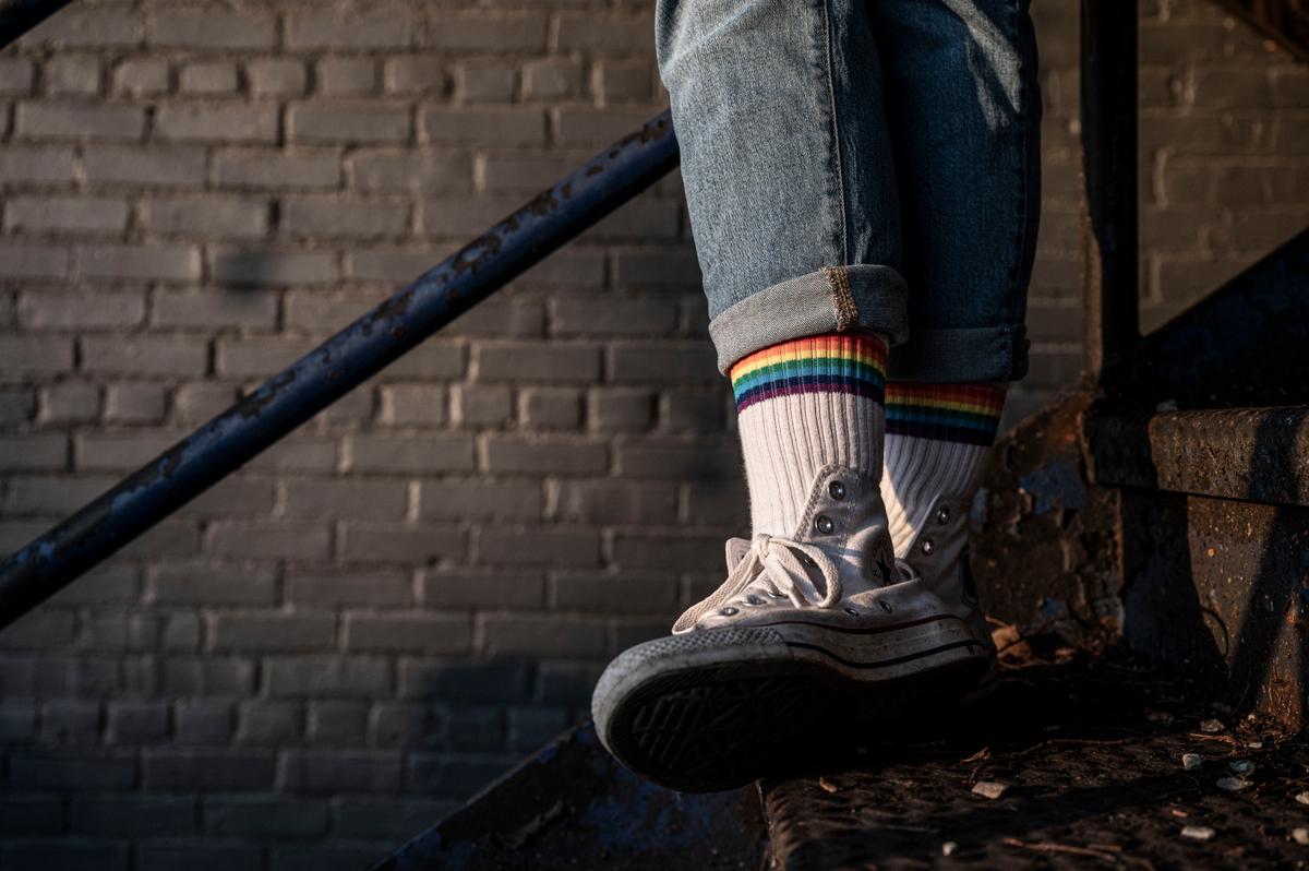 A person wearing rainbow socks stands on a stairway during a drag show at a brewery in Louisville, Ky., on June 4, 2021. (Jon Cherry/Getty Images)