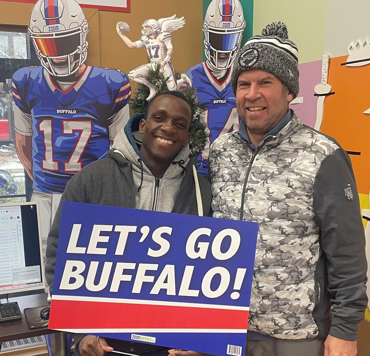 Mr. Mlondani with Mr. Allen after receiving the GoFundMe donations raised to help replace his family’s car. "The words 'Let’s go Buffalo' has new meaning to the Mlondani family," Mr. Allen said. (Courtesy of Rory Allen)