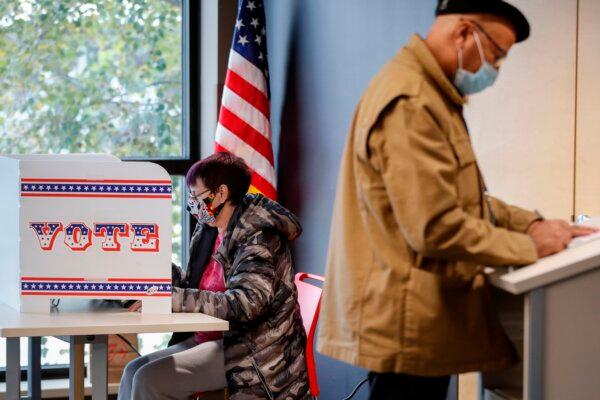 People cast their ballots on the first day of in-person early voting for the Nov. 3, 2020, elections in Milwaukee, Wis., on Oct. 20, 2020. (Kamil Krzaczynski/AFP via Getty Images)