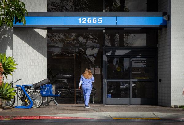 A nurse enters a hospital in Garden Grove, Calif., on Dec. 20. 2023. (John Fredricks/The Epoch Times)