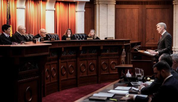 Attorney Eric Olson, far right, argues before the Colorado Supreme Court in Denver, on Dec. 6, 2023. (David Zalubowski, Pool/AP Photo)