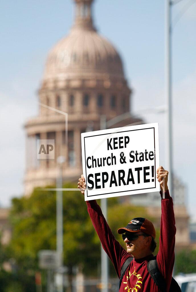 Joe Zamecki protests outside a meeting of the Texas Board of Education in Austin on July 21, 2011. (Eric Gay/AP Photo)