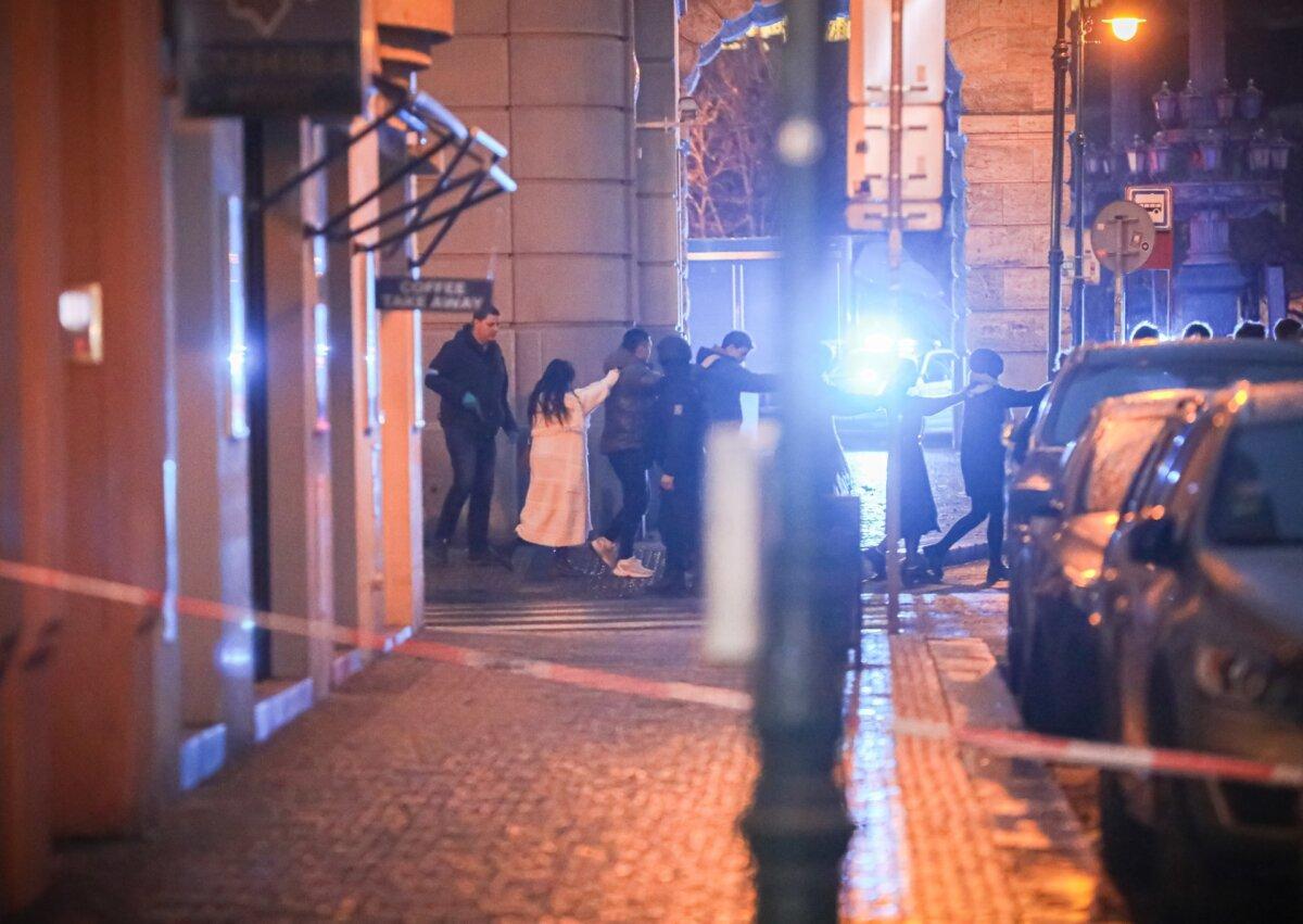 Students of Charles University are being evacuated by police at the location of the shooting in Prague on Dec. 21, 2023. (Gabriel Kuchta/Getty Images)