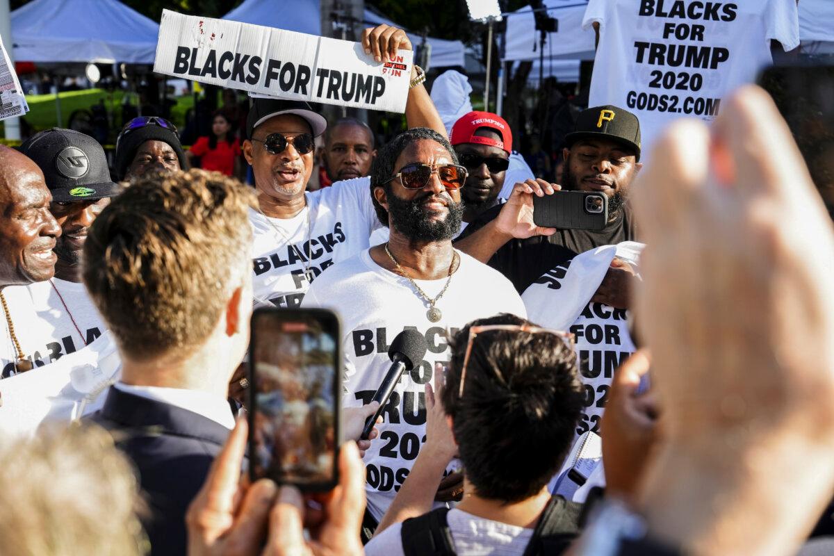 Protesters wearing “Blacks for Trump” t-shirts speak to the press outside the Wilkie D. Ferguson Jr. United States Courthouse in Miami, Fla., on June 13, 2023. (Madalina Vasiliu/The Epoch Times)