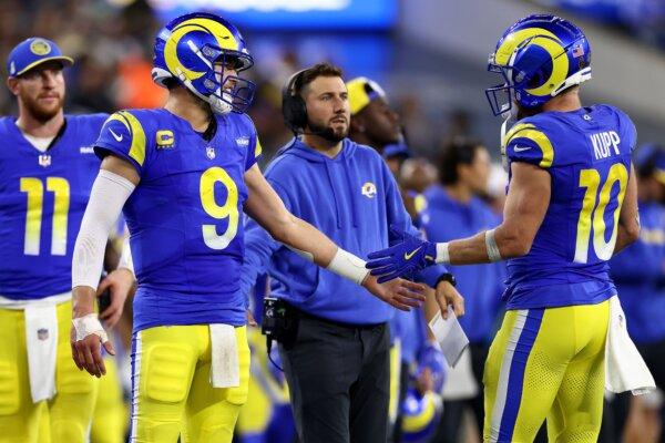 Matthew Stafford (9) of the Los Angeles Rams high-fives Cooper Kupp (10) on the sideline against the New Orleans Saints during the third quarter of the game at SoFi Stadium in Inglewood, Calif., on Dec. 21, 2023. (Katelyn Mulcahy/Getty Images)