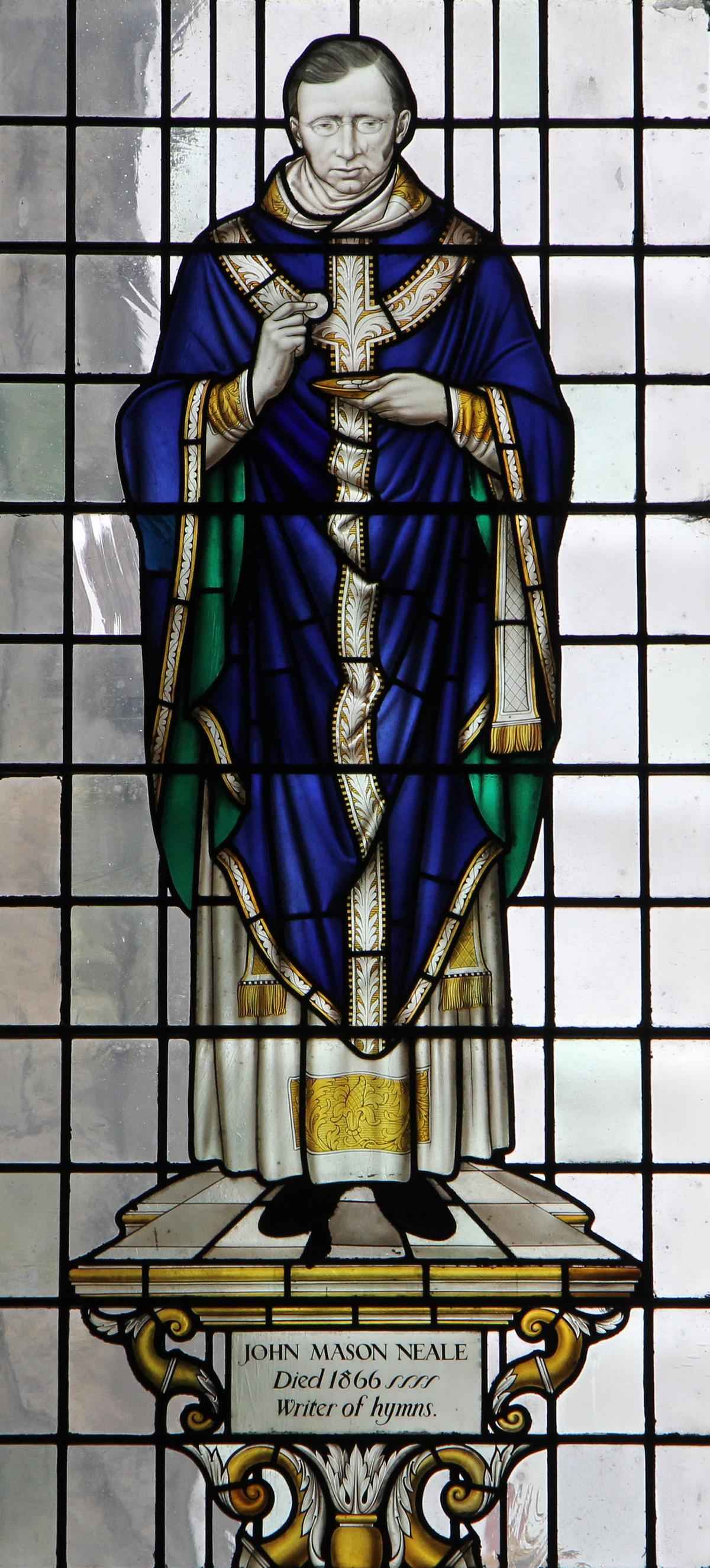 Stained glass window of Rev. John Mason Neale in Chichester Cathedral, UK. (Cropped image from<a href="https://commons.wikimedia.org/wiki/File:Chichester_Cathedral_IMG_7394_(35544500665).jpg"> Fr James Bradley</a>/<a href="https://creativecommons.org/licenses/by/2.0/deed.en">CC BY 2.0 DEED</a>)
