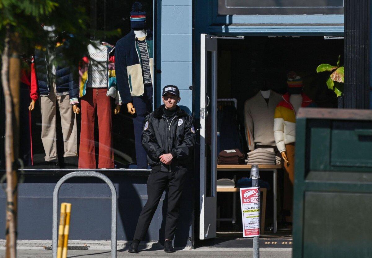 A security guard stands in front of a store in the Hayes Valley neighborhood of San Francisco on Nov. 2, 2022. (Samantha Laurey/AFP via Getty Images)