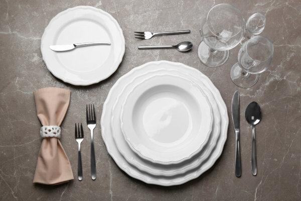 A formal table setting bring a dash of Downton Abbey to your celebrations. (New Africa/Shutterstock)