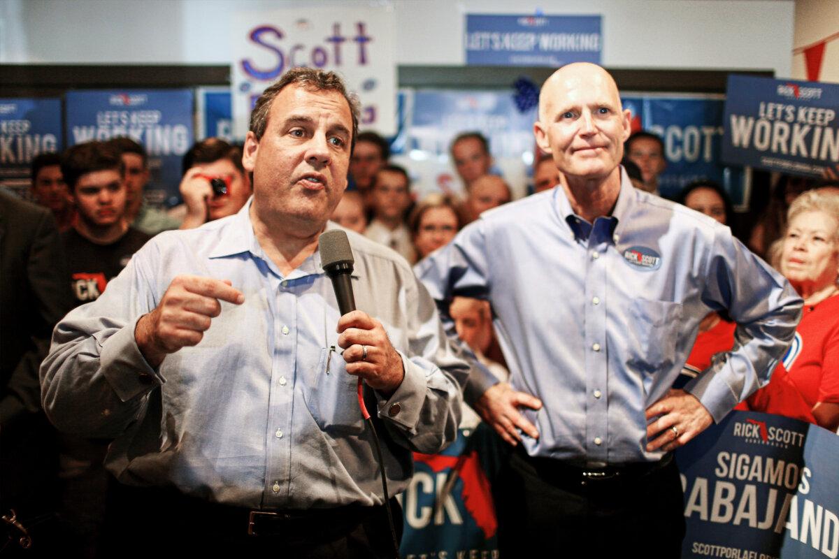 Then-New Jersey Gov. Chris Christie (L) and then-Florida Gov. Rick Scott make a campaign stop at a Vero Beach Field Office in Vero Beach, Fla., on Oct. 16, 2014. (Joe Raedle/Getty Images)
