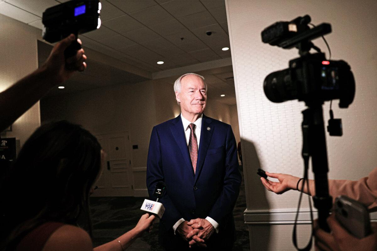 Republican presidential candidate Asa Hutchinson speaks to reporters at the Moms for Liberty Joyful Warriors national summit in Philadelphia on July 1, 2023. (Michael M. Santiago/Getty Images)