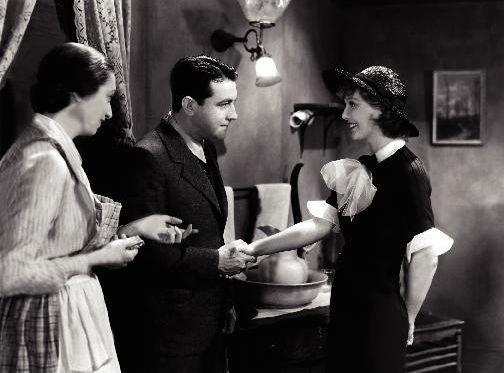 (L–R) Mary Dennis (Aline MacMahon), Thomas Holmes (Richard Barthelmess), and Ruth Loring Holmes (Loretta Young), in “Heroes for Sale." (Warner Bros. Pictures)