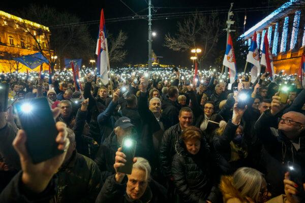 Serbian opposition supporters during a protest outside the electoral commission building in Belgrade, Serbia, on Dec. 25, 2023. (Darko Vojinovic/AP)