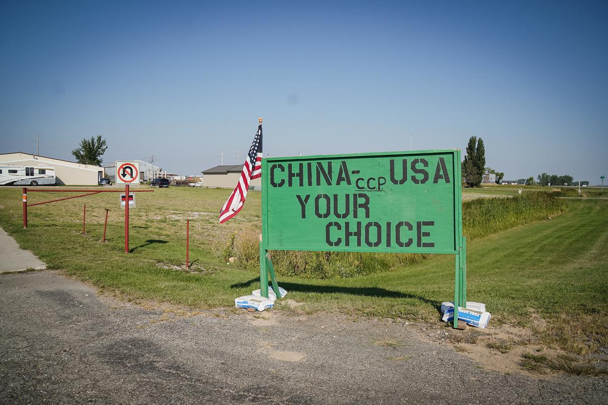 A sign opposing a Chinese-connected corn mill stands near 370 acres recently annexed by the city for the project, in Grand Forks, N.D., in this file photo. (Allan Stein/The Epoch Times)