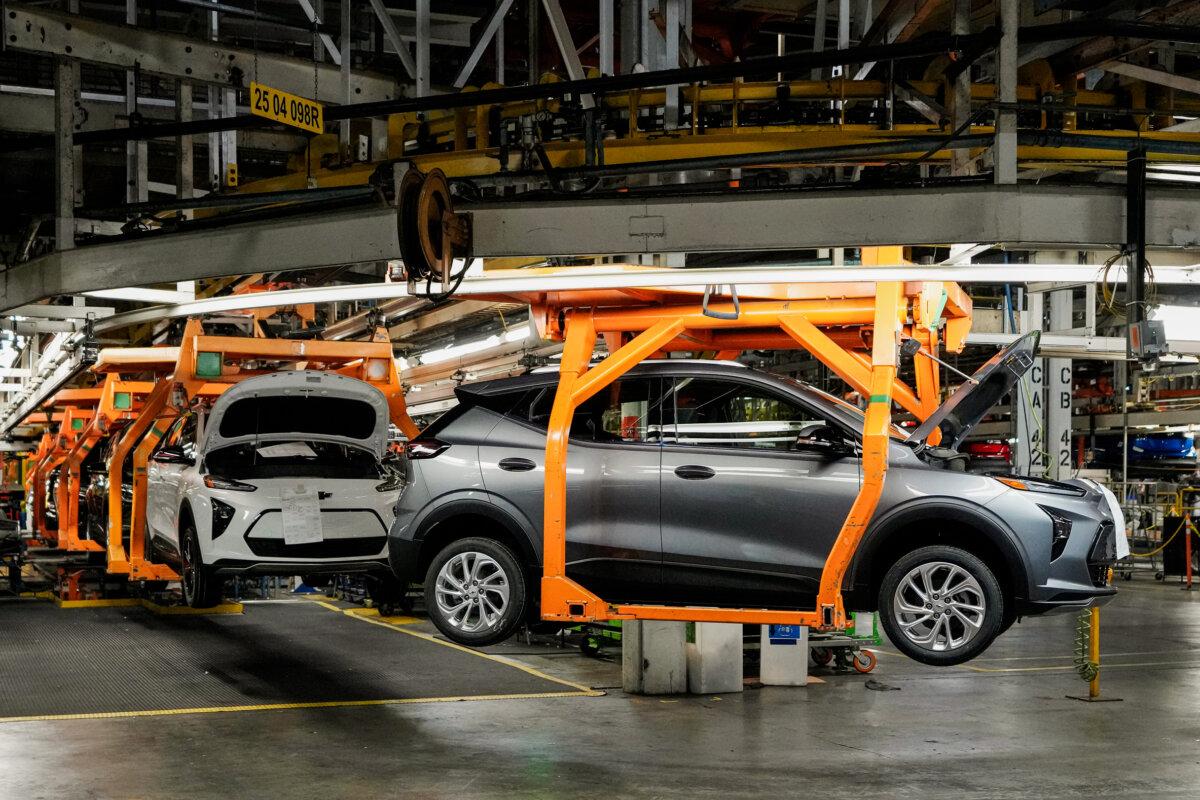 Vehicles move along the 2023 Chevrolet Bolt EV and EUV assembly line at the General Motors Orion Assembly in Lake Orion, Mich., on June 15, 2023. Despite new electric vehicle sales hitting a record in the United States this year, sales growth is starting to slow and fall short of the auto industry's lofty ambitions to transition away from combustion engines. (AP Photo/Carlos Osorio, File)
