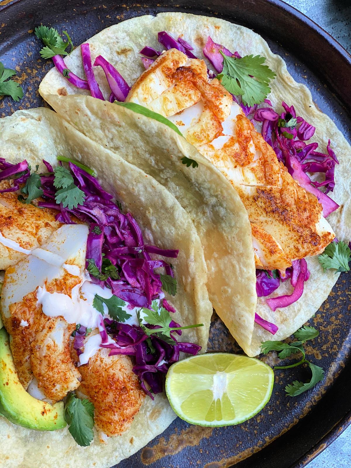 These light and bright fish tacos are finished with a vibrant salsa verde, either homemade or store-bought. (Lynda Balslev for Tastefood)