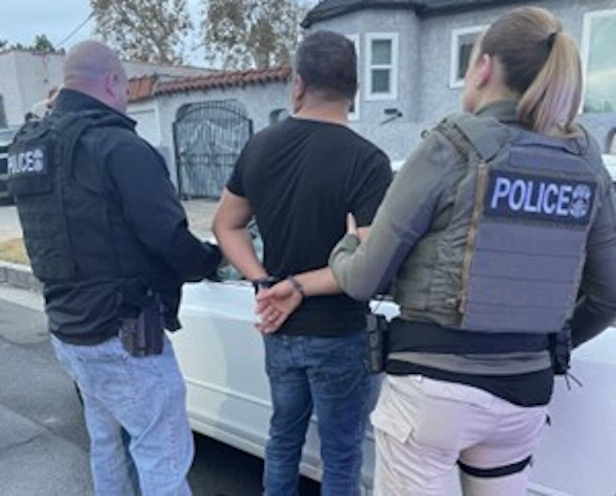 Immigration and Customs Enforcement officers arrest an illegal immigrant in Los Angeles, in a photo released on Dec. 21, 2023. (U.S. Immigration and Customs Enforcement)