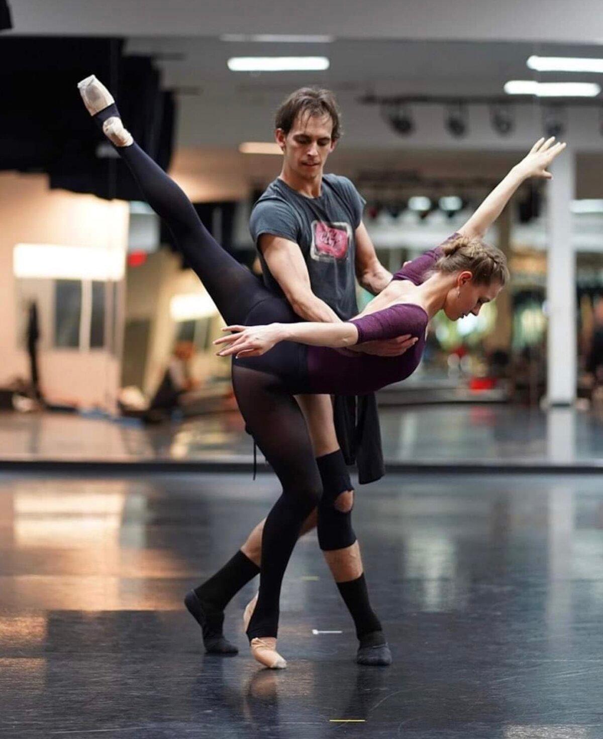Ms. Nyman rehearses with dancer Brett Young. (Joamanuel Velazquez)