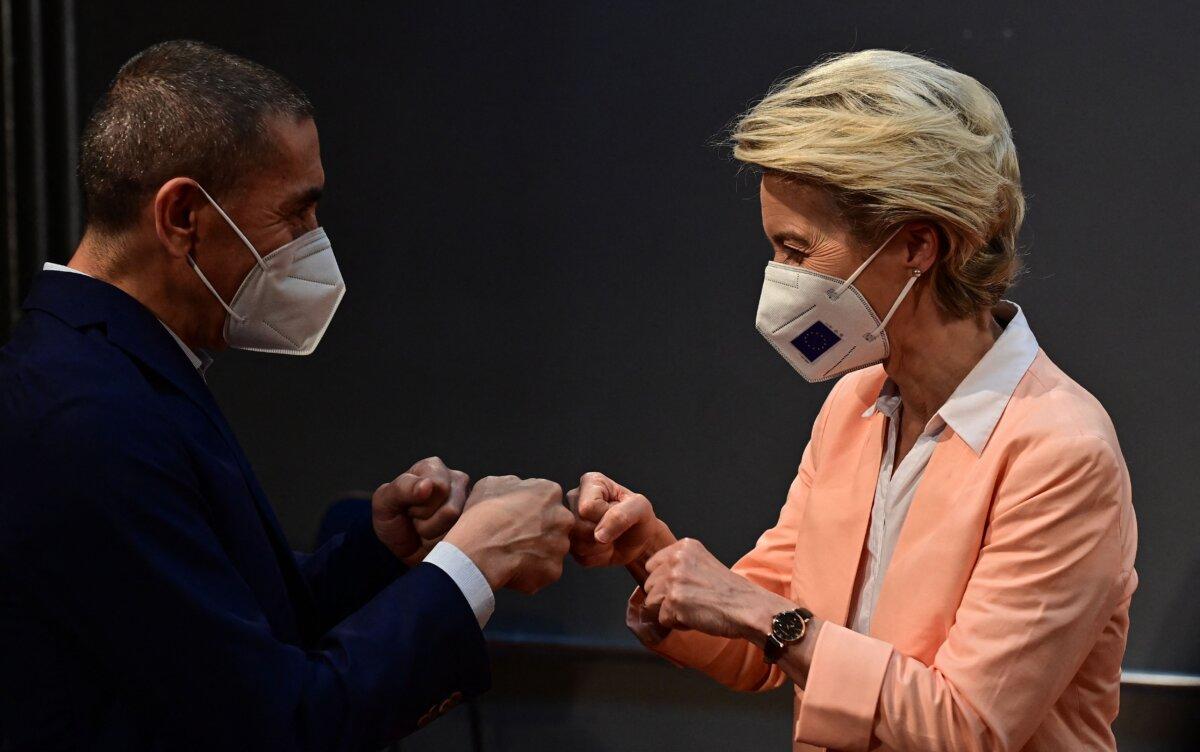 (L-R) Co-founder and CEO of German biotechnology company BioNTech Ugur Sahin and European Commission President Ursula von der Leyen greet as they arrive to attend the Vaccine Equity for Africa event in Berlin on Aug. 27, 2021. (Tobias Schwarz/AFP via Getty Images)