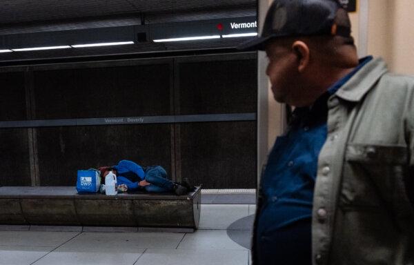 Homeless individuals scatter across the Los Angeles Metro system in Los Angeles on April 19, 2023. (John Fredricks/The Epoch Times)